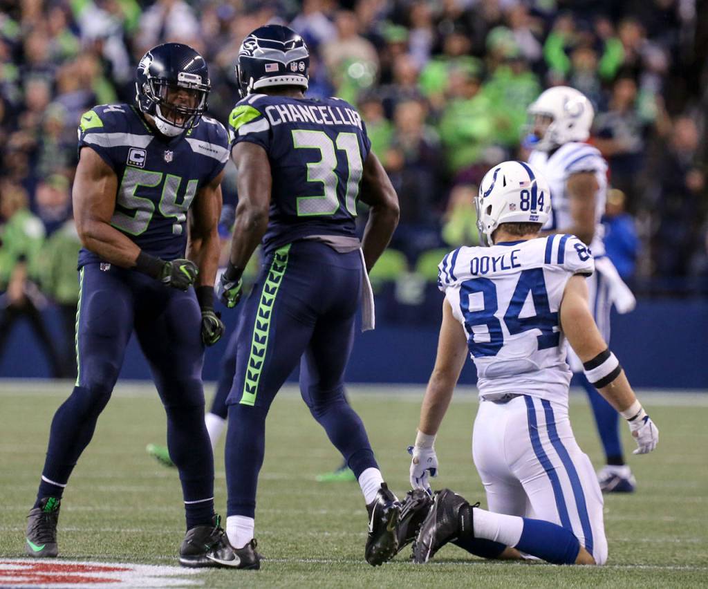 Seahawks linebacker Bobby Wagner, left, and Seahawks safety Kam Chancellor celebrates a pass by Chancellor on Colts tight end Jack Doyle Sunday night at CenturyLink Field in Seattle on October 1, 2017. Seahawks won 46-18. (Kevin Clark / The Herald)