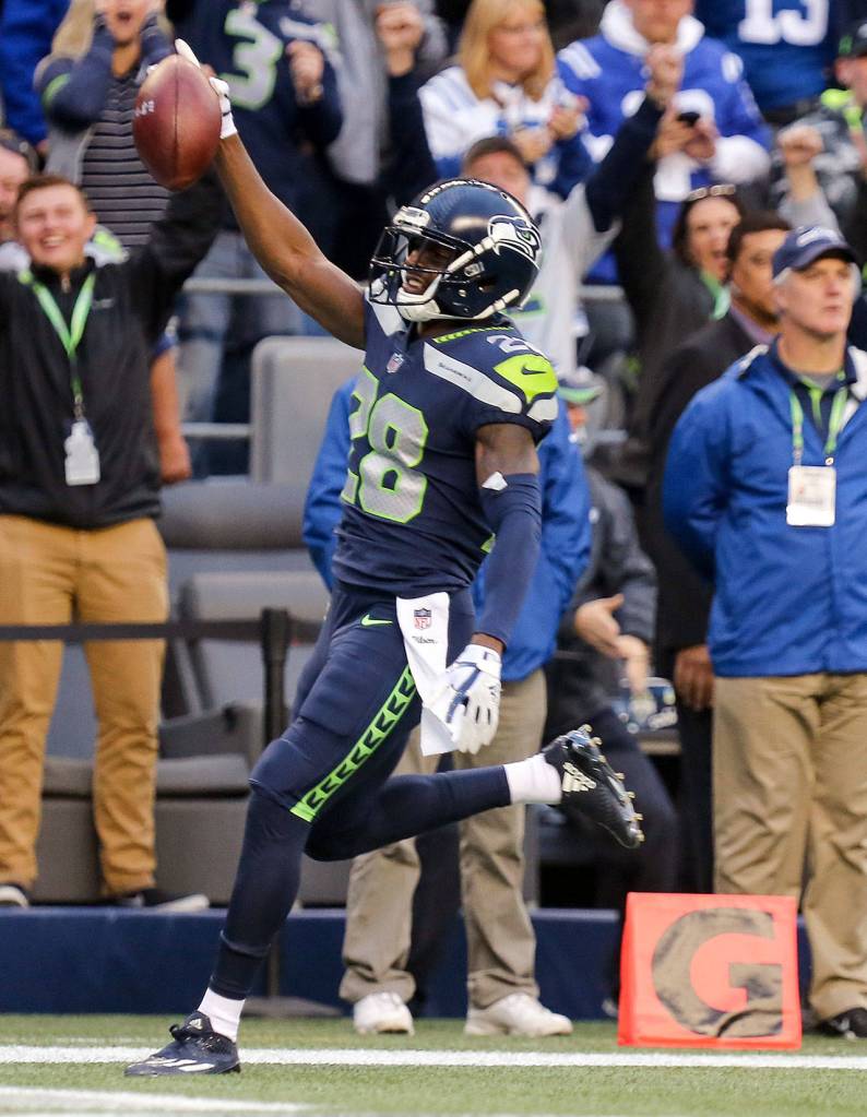 Seahawks corner back Justin Coleman celebrates his touchdown after an interception against the Colts Sunday night at CenturyLink Field in Seattle on October 1, 2017. Seahawks won 46-18. (Kevin Clark / The Herald)