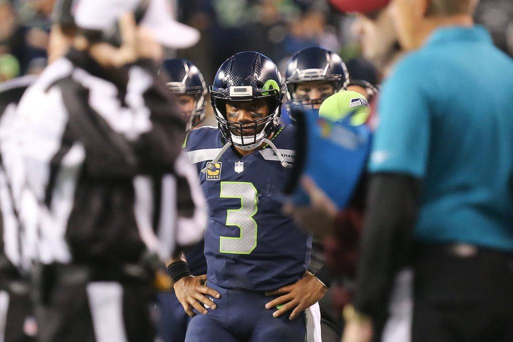 Seahawks quarterback Russell Wilson awaits the instant replay to confirm his touchdown run against the Colts Sunday night at CenturyLink Field in Seattle on October 1, 2017. Seahawks won 46-18. (Kevin Clark / The Herald)