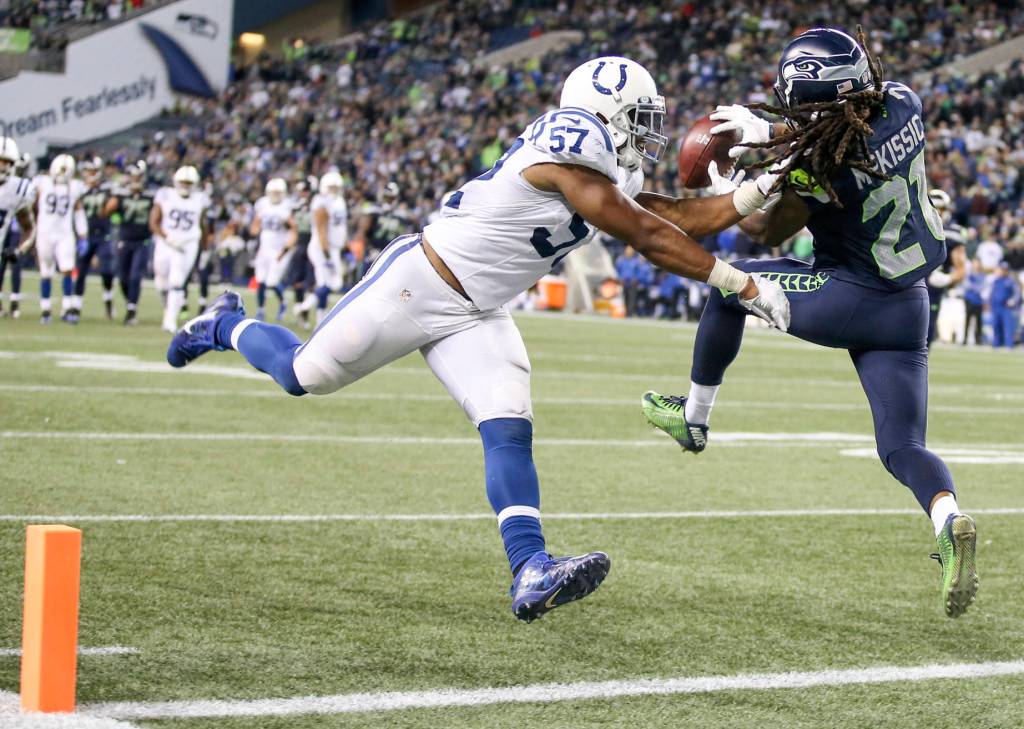 Seahawks running back J.D. McKissic makes a touchdown reception over Colts linebacker Jon Bostic Sunday night at CenturyLink Field in Seattle on October 1, 2017. Seahawks won 46-18. (Kevin Clark / The Herald)