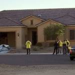 Police stand outside the home of Stephen Paddock on Monday in Mesquite, Nevada. Police identified Paddock as the gunman at a music festival Sunday evening. (Mesquite Police via AP)