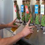 A bartender pours two beers at Bale Breaker Brewing in Moxee. (Photo courtesy of Nicol Sloon/Yakima Valley Tourism)