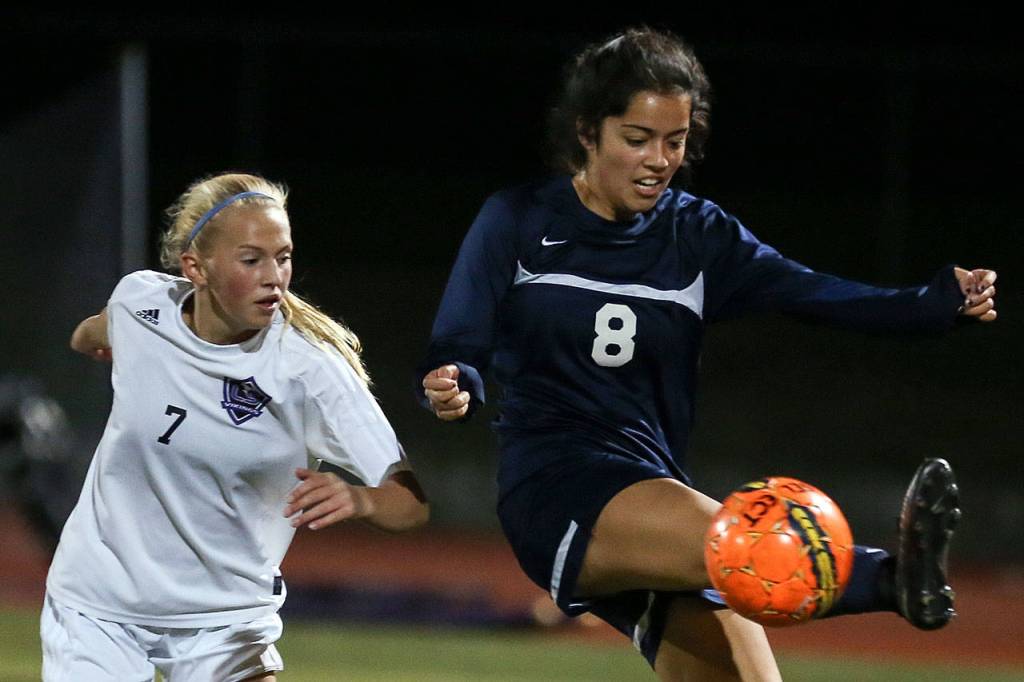 Glacier Peaks Taylor Brame controls the ball with Lake Stevens Callaway Knutson trailing Thursday night at Lake Stevens High School on October 5, 2017. (Kevin Clark / The Herald)
