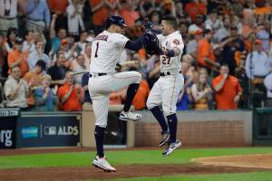 Altuve hits 3 homers, Astros beat Red Sox 8-2 in ALDS opener