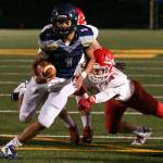 Arlingtons Tallen Williams rushes for a touchdown past Marysville Pilchucks Corbin Sims during a game Oct. 6, 2017, at Arlington High School. (Kevin Clark / The Herald)