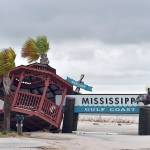 A gazebo is blown over the Mississippi Gulf Coast welcome sign near the intersection of Hewes Avenue and U.S. 90 in Gulfport, Mississippi, on Sunday, after Hurricane Nate made landfall on the Gulf Coast. (Justin Sellers/The Clarion-Ledger via AP)