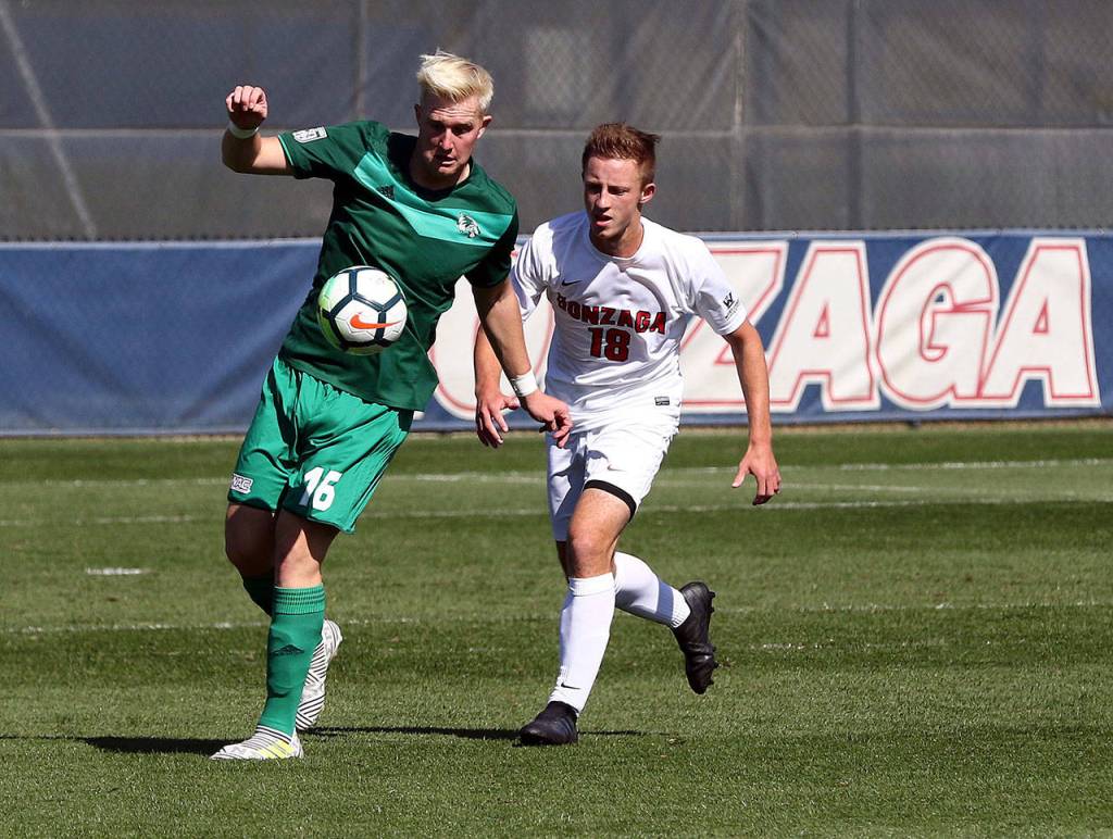 Gonzagas Brady Henderson marks an opposing player during a match earlier this season in Spokane. Henderson is one of three Archbishop Murphy alumni starting for the Zags mens soccer team. (Gonzaga University photo)