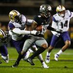 Washington linebacker Azeem Victor (36) pulls down Colorado wide receiver Juwann Winfree (9) in the first half of a game Sept. 23, 2017, in Boulder, Colo. (AP Photo/David Zalubowski)