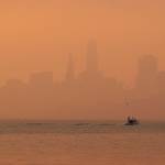 The San Francisco skyline is obscured by smoke and haze from wildfires Thursday in this view from Sausalito, Califorina. (AP Photo/Eric Risberg)
