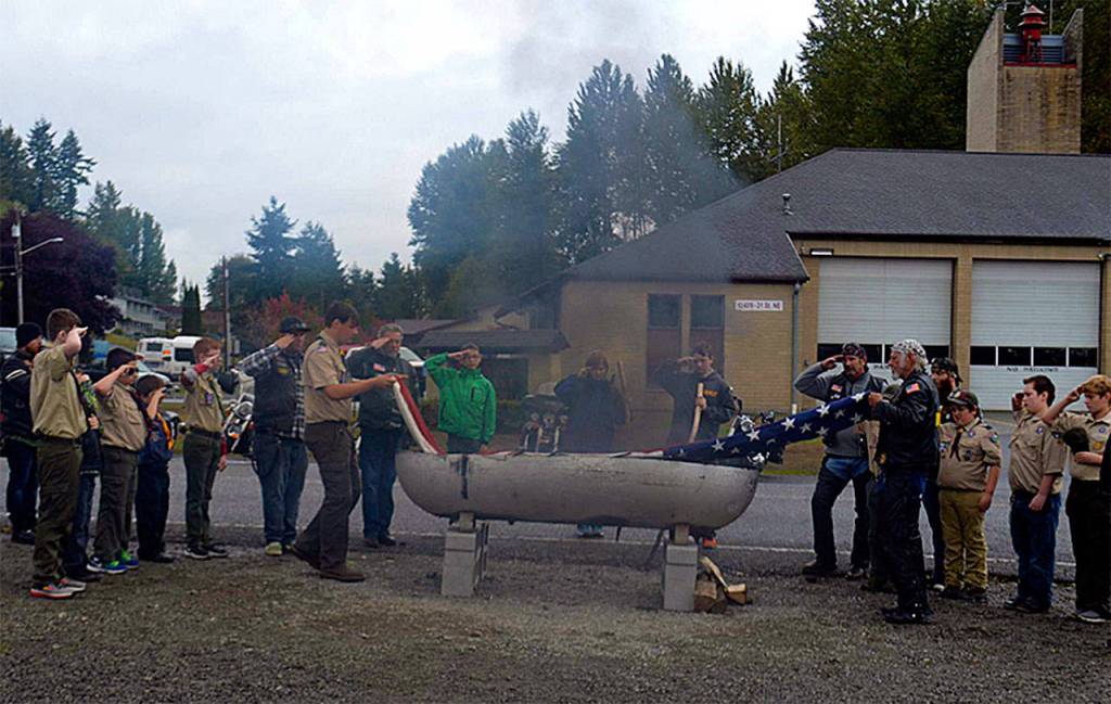 Lake Stevens Boy Scout Troop 42 participated in a flag retirement ceremony at the Lake Stevens Fire Department, retiring 645 in just under three hours, as part of a Day of Service marking the centennial year of the Mount Baker Council. (Contributed photo)