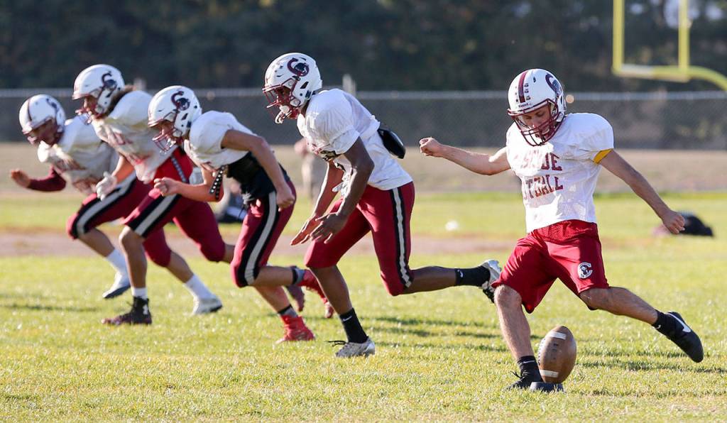 Cascade senior Sarmad Aqrawi kicks off during practice Oct. 5, 2017, at Cascade High Schoolin Everett. (Kevin Clark / The Herald)
