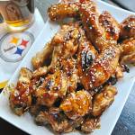 Like chicken wings with your football? Make these honey Sriracha wings with sesame seeds for the next game. (Gretchen McKay/Pittsburgh Post-Gazette)