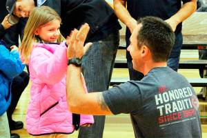 Firefighters give coats to Liberty first-graders