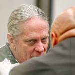 Convicted bank robber Christian Franzwa listens to his attorney Jon Scott moments before his sentencing hearing begins with Judge Eric Lucas in Snohomish County Superior Court, Wednesday. (Dan Bates / The Herald)