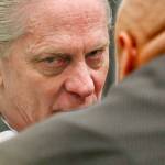 Convicted bank robber Christian Franzwa listens to his attorney, Jon Scott, moments before his sentencing hearing begins with Judge Eric Lucas in Snohomish County Superior Court on Wednesday. (Dan Bates / The Herald)