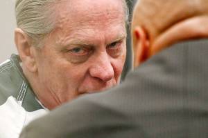 Convicted bank robber Christian Franzwa listens to his attorney, Jon Scott, moments before his sentencing hearing begins with Judge Eric Lucas in Snohomish County Superior Court on Wednesday. (Dan Bates / The Herald)
