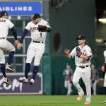 The Astros Carlos Correa and George Springer celebrate after beating the Yankees 7-1 in Game 6 of the American League Championship Series on Oct. 20, 2017, in Houston. (AP Photo/David J. Phillip)