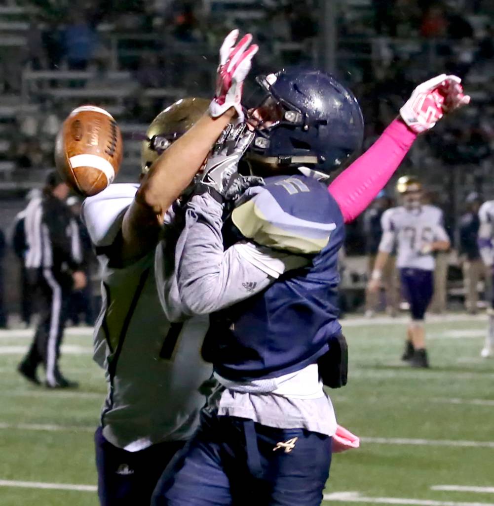 Oak Harbors Kyle Nickols breaks up a touchdown pass intended for Arlingtons Campbell Hudson at Arlington High in Arlington on Oct. 20. (Kevin Clark / The Herald)