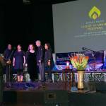 Bennett Montgomery, conductor, leads Misha Carter (from left), Naomi Montgomery, Elaine Montgomery, Chris Hansen and Daisy Hansen in music at the Light of Unity Festival, held Oct. 21 at Northwest Music Hall to mark the 200th anniversary of the birth of the founder of the Bahai faith. (Contributed photo)