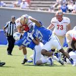 Jack Flor, of Bothell, helps take down an opponent at a Sept. 2 game to help the Air Force Falcons go on to a 62-0 victory over the Virginia Military Institute Keydets. Flor (No. 50), son of Tom and Teresa Flor, is a senior at the U.S. Air Force Academy. He graduated in 2014 from ODea High School in Seattle. (U.S. Air Force photo / Jason Gutierrez)