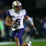 Washington defensive back Myles Bryant runs for a touchdown after intercepting a pass thrown by Colorado quarterback Steven Montez during a game on Sept. 23, in Boulder, Colorado. (AP Photo/David Zalubowski)
