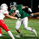 Edmonds-Woodways Cappasio Cherry (6) breaks a tackle during a game against Snohomish at Edmonds Stadium on Friday, Oct. 27. (Ian Terry / The Herald)
