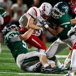 Snohomishs Tyler Massena (center) is brought down by Edmonds-Woodways Tyler McAtee (left) and Dominic Lawrence (right) during the Warriors 38-17 win over the Panthers on Friday at Edmonds Stadium. (Ian Terry / The Herald)