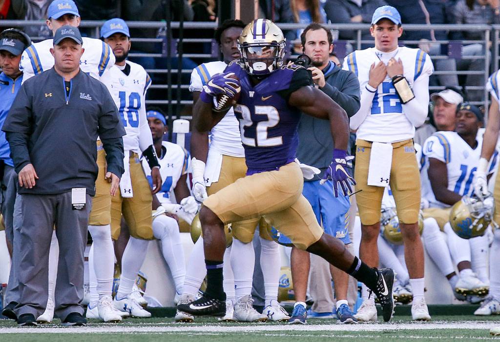 Washingtons Lavon Coleman races along the UCLA sideline on Oct. 28, 2017, at Husky Stadium. Washington won 44-23. (Kevin Clark / The Herald)