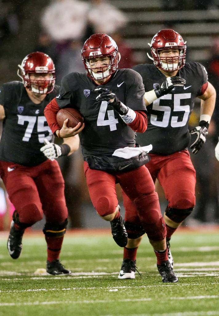 Washington State Cougars quarterback Luke Falk (4) runs for a first down as the Cougars beat the Colorado Buffaloes 28-0 at Martin Stadium on Oct. 21, 2017 in Pullman. (Andy Bronson / The Herald)