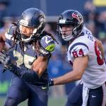 Seahawks cornerback Richard Sherman returns a interception with Texans Ryan Griffin trailing Sunday afternoon at CenturyLink Field on October 29, 2017`.(Kevin Clark / The Herald)                                Seahawks cornerback Richard Sherman returns a interception with Texans Ryan Griffin trailing Sunday afternoon at CenturyLink Field. (Kevin Clark / The Herald)