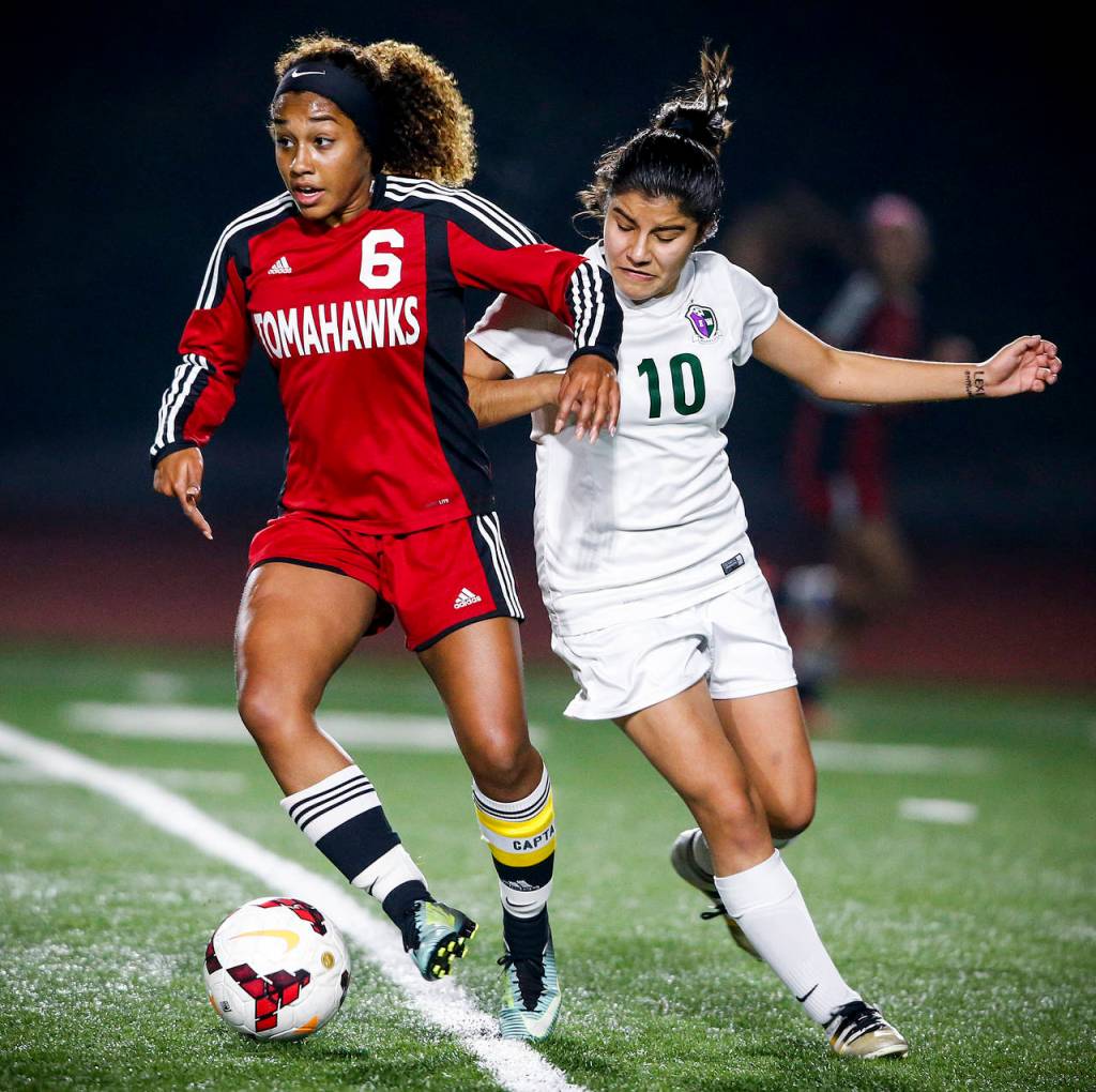 Marysville Pilchucks Olivia Lee (6) shields the ball from Edmonds-Woodways Jazmine Nunez (10) during a 3A district semifinal Tuesday at Edmonds Stadium. (Ian Terry / The Herald)