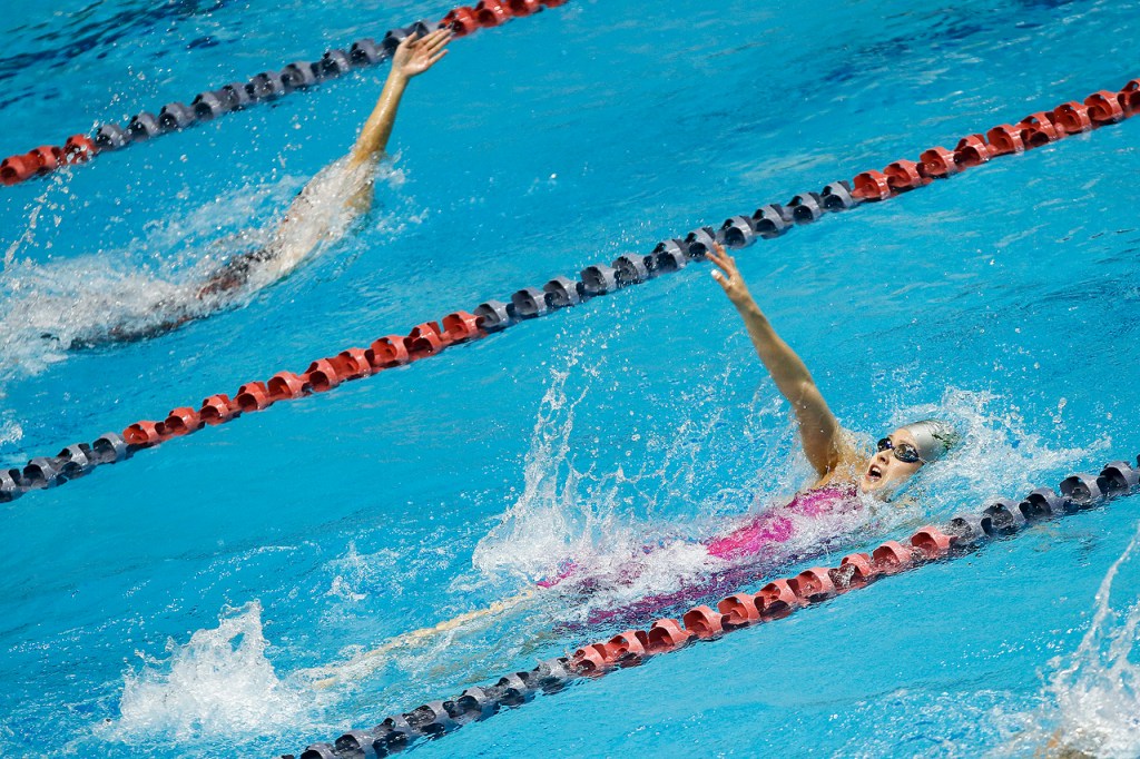 Jacksons Nicole Limberg (right) swims on her way to winning the 200-yard individual medley at the 4A State Girls Swimming and Diving Championship at the King County Aquatic Center in Federal Way on Saturday, Nov. 12. (Ian Terry / The Herald)