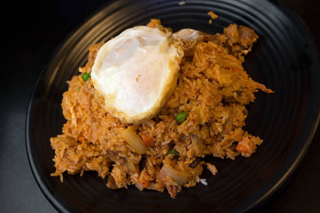 Korean fried rice topped with a fried egg. (Andrew Bronson / The Herald)