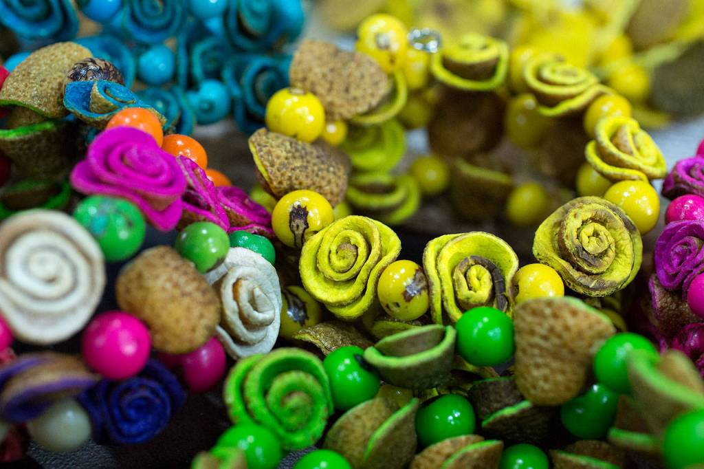 These bracelets are made of dried orange peels. (Andy Bronson / The Herald)