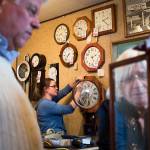 Crystal Rice, works on a customers clock as owner Susie Hennig, right, winds a time-and-strike clock brought in by Steve Heath at A House of Clocks on Monday, Oct. 30, 2017 in Lynnwood, Wa. The landmark Lynnwood shop plans to close after more than 54 years. David Nofziger said he and his siblings, who took over the business from their parents, are closing the shop because theyre reaching retirement age. (Andy Bronson / The Herald)