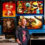 Artist Justin Hillgrove, creator of Imps and Monsters, in his studio. (Dan Bates / The Herald)