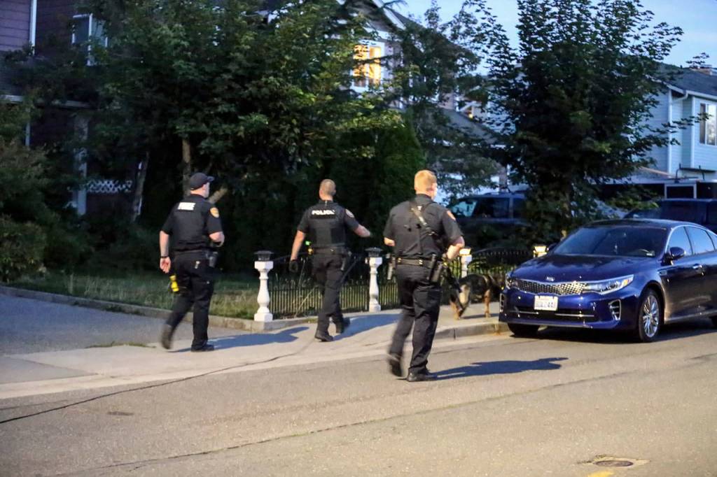 Police canvas the area looking for the shooter of David Sandoval on Oct. 4. (Kevin Clark / The Herald)