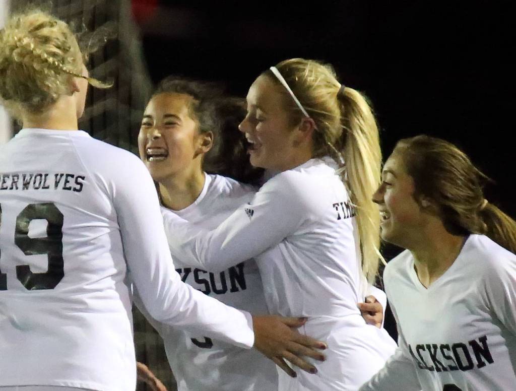 Jacksons Katie Chengs (second from left) celebrates her goal with teammates in the first half of a playoff game against Lake Stevens on Nov. 2, 2017, at Goddard Stadium in Everett. (Kevin Clark / The Herald)