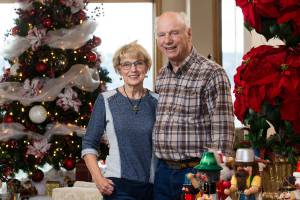 Sally and Tom Joy surrounded by Christmas decorations at their home on Wednesday, Nov. 15, 2017 in Mukilteo, Wa. The Joys are opening their home to the holiday home tour, a fundraiser for the Assistance League. (Andy Bronson / The Herald)
