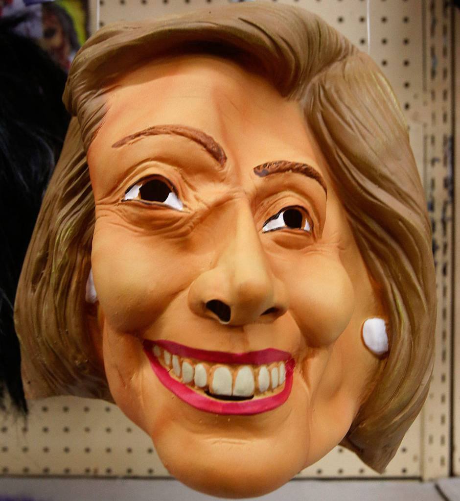 Halloween came and went two weeks ago, yet Hillary Clintons mask, along with a JFK version, hangs around at Everett Display & Costume Monday as the store prepares to close its doors Nov. 30. (Dan Bates) / The Herald)