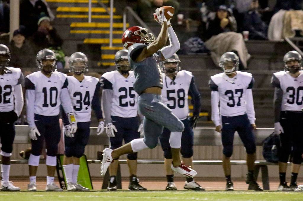 Archbishop Murphys Kyler Gordon makes a catch near the River Ridge sideline during a 2A state playoff game on Nov. 10, 2017, at Goddard Stadium in Everett. (Kevin Clark / The Herald)