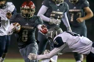 Archbishop Murphys Ray Pimentel rushes for yards with River Ridges Kieran Hunkin attempting a tackle Friday night at Goddard Stadium at Mariner High in Everett on November 10, 2017. (Kevin Clark / The Herald)