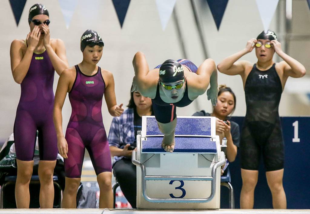 Jacksons Chloe Limargo leads off in the 200-yard freestyle relay during the 4A state swim and dive championships on Nov. 11, 2017, at the King County Aquatic Center in Federal Way. Jackson finished third in the event. (Kevin Clark / The Herald)