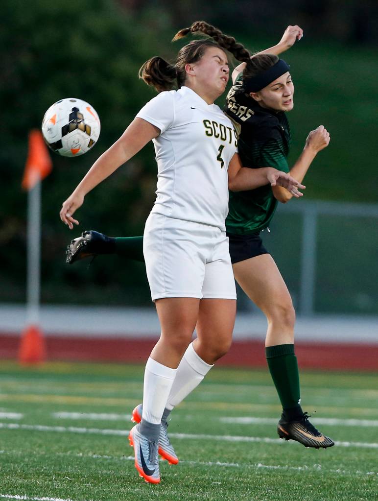 Shorecrests Rohorrie Henning (left) goes up for a header against Marysville-Getchells Hayli Huhta during a game at Edmonds Stadium on Oct. 31. (Ian Terry / The Herald)