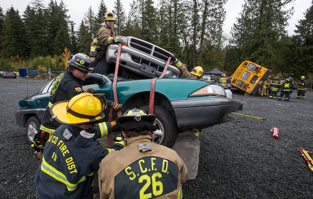 Snohomish County area fire departments practice multi-agency response training for vehicle accidents. (Andy Bronson / The Herald)