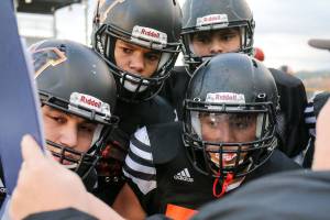 Members of the offensive line look over a play during practice Wednesday afternoon at Monroe High in Monroe on November 15, 2017. (Kevin Clark / The Herald)