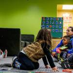 While their moms are taking the ESOL class in another room in the facility, a dozen or so 5-and-younger preschoolers recieve instruction from teacher Rosa Asturias (right) and teacher assistant Elsa Perez, who are both with the YMCA. (Dan Bates / The Herald)
