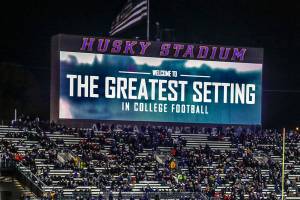 The Lake Washington view from the Greatest Setting in College Football is behind the sign that says it is so. The setting is lost in the blackness, so folks visiting from Salt Lake City to support their Utes last Saturday night had to take our word for it. (Dan Bates / The Herald)