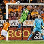 Seattles Will Bruin (17) heads a goal past Houstons Joe Willis (31) during the first half of the Sounders 2-0 victory over the Dynamo in the first leg of the Western Conference finals Tuesday in Houston. (Brett Coomer/Houston Chronicle via AP)