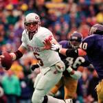 Washington State quarterback Ryan Leaf is pressured by Washington defenders during the Apple Cup on Nov. 22, 1997, in Seattle. (Rod Mar/The Seattle Times via AP)